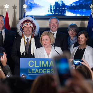 Premier Rachel Notley flanked by Treaty No.6 Grand Chief Tony Alexis from Alexis Nakota Sioux Nation while announcing Alberta's Climate Leadership Plan.
